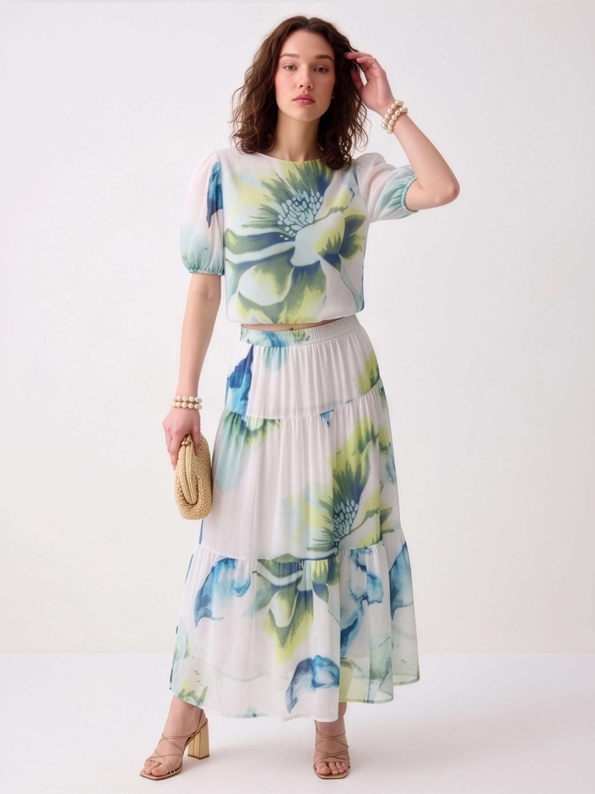 Woman wearing a floral dress with a white background