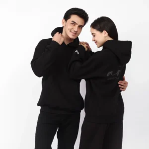 Model wearing the black "Art Limitless" unisex hoodie, front view showing the small art logo.