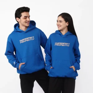 Two models wearing the unisex On Purpose hoodie in a city park.