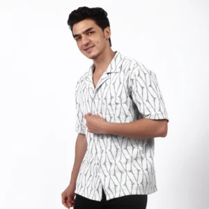 Resort shirt styled with dark trousers.